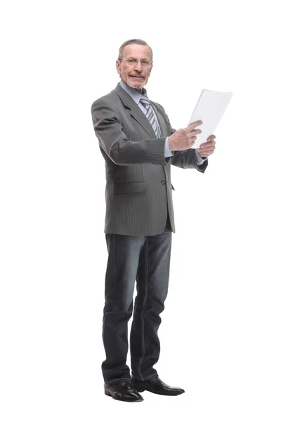 Shot of a senior professional man holding papers in his hand and doing some paperwork — Stock fotografie