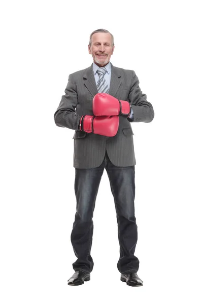 Serious caucasian elderly man in business formal outfit in boxing gloves hitting — Φωτογραφία Αρχείου