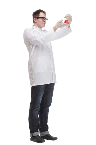 Confident man doctor wearing unifrom and glasses holding beaker — Stock Photo, Image