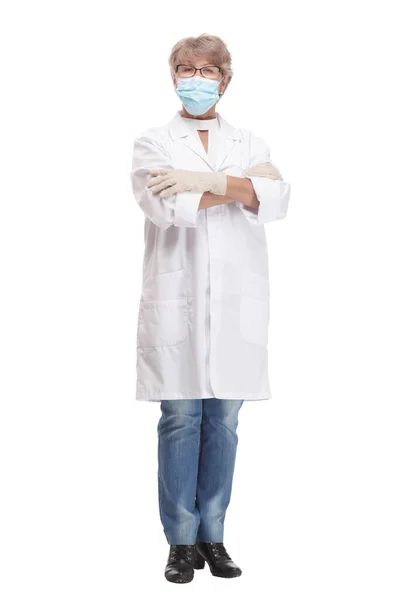 Confident experienced young doctor woman with face mask and gloves isolated on white background — Fotografia de Stock