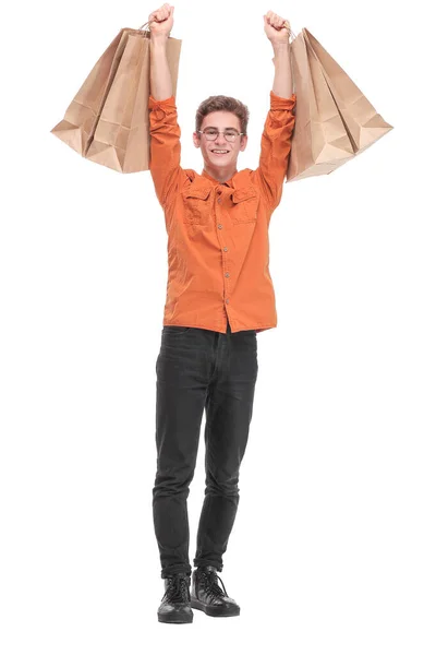 Fénykép jóképű fiatal sikeres férfi emelje bevásárló táskák izgatott hangulat ruhát vásárolni — Stock Fotó