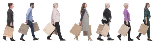 Μια ομάδα ανθρώπων τρέχει χάρτινες σακούλες για ψώνια. — Φωτογραφία Αρχείου
