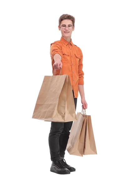 Přední pohled na mladého muže nakupování v obchoďáku s mnoha nákupních tašek v ruce — Stock fotografie
