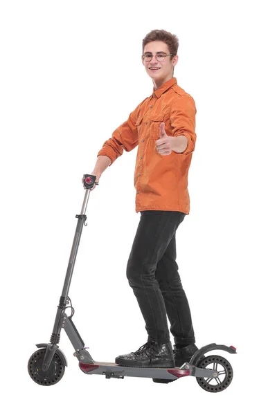 Vista laterale di uomo felice cavalca uno scooter calcio nero — Foto Stock