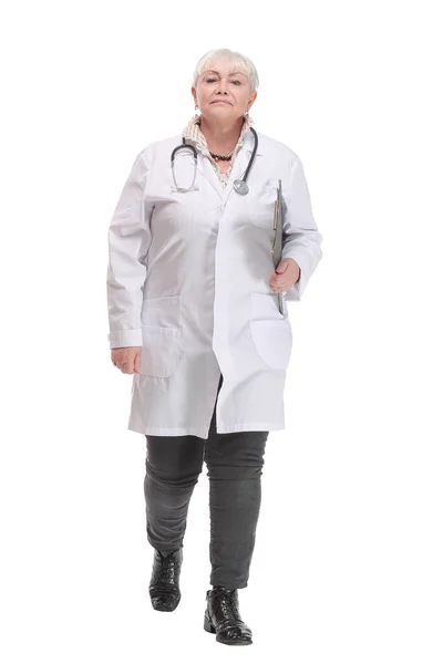 Image of a young female doctor holding a clipboard and walking to the camera — Stock Photo, Image