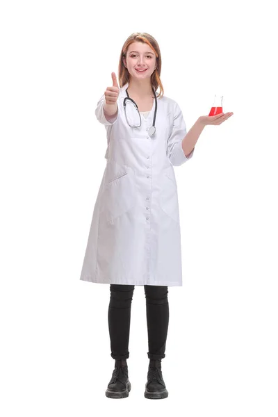 Front view of young scientist or doctor hold chemical flask with red liquid and thumb up. — Stock Photo, Image