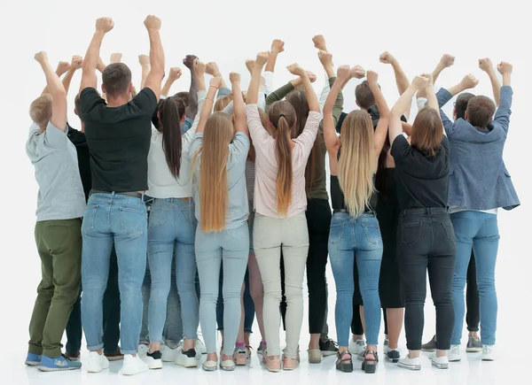 Team van gelukkige jongeren staan met handen omhoog — Stockfoto