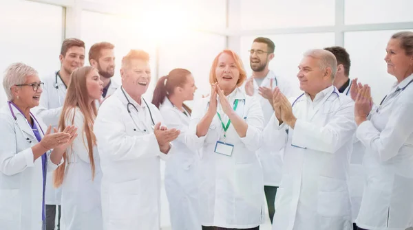 Group of diverse smiling doctors applauding together. — Stock Photo, Image