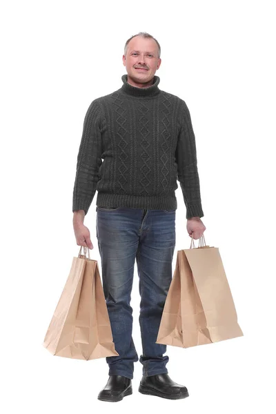 Ganzes Porträt eines jungen, lässigen Mannes mit Einkaufstaschen — Stockfoto