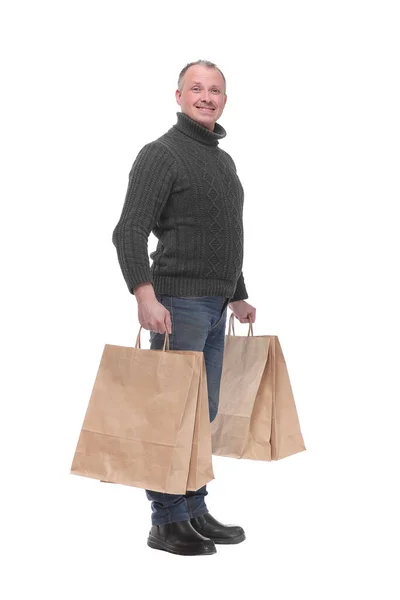 Portrait complet d'un jeune homme décontracté tenant des sacs à provisions — Photo