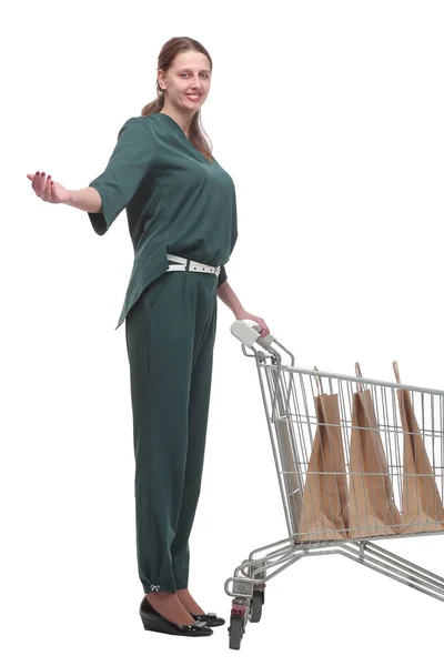 Side view of young woman with shopping cart — Stock Photo, Image