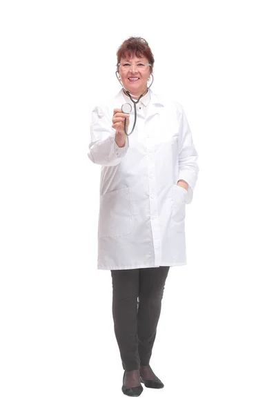 Mature woman doctor with stethoscope in ears and checking listening heart pulse pose — Stock Photo, Image