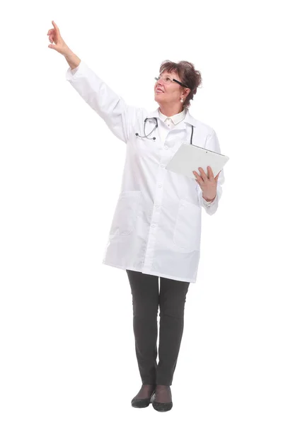 Serious mature doctor in lab coat holding tablet — Stock Photo, Image