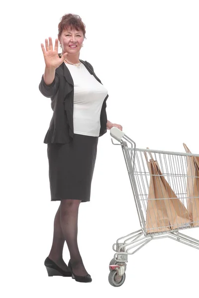 Full length portrait of a woman pushing a shopping trolley — Stock Photo, Image