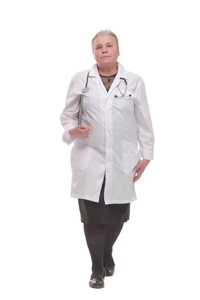 Front view of mature woman doctor walking with clipboard — Stock Photo, Image