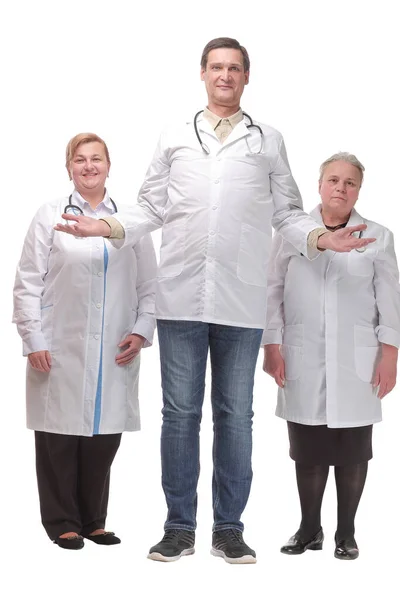 Senior smiling doctor with his colleagues in front of the camera — Stock Photo, Image