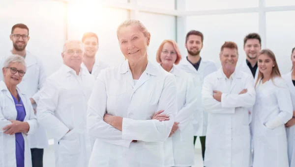 Large group of people in white coats standing together. — Stock Photo, Image