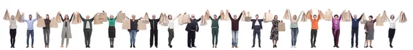 A group of people are running paper shopping bags — 图库照片