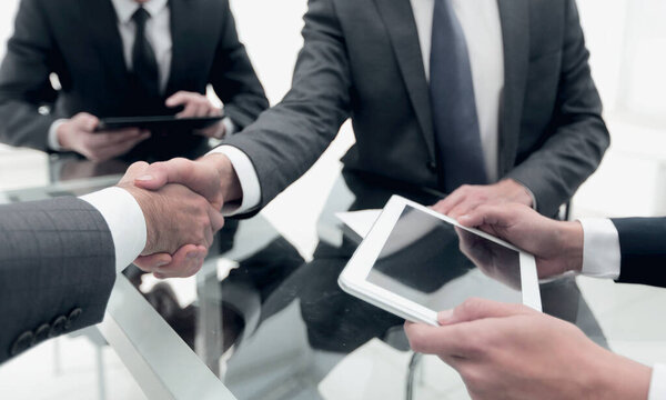 close up. business people handshake over the Desk