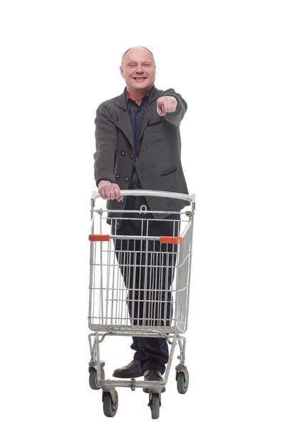 Smiling casual man with shopping cart .isolated on a white background. — Stock Photo, Image