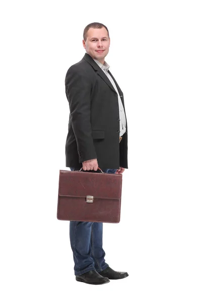 Negócio masculino de pé e segurando uma mala, corpo inteiro vista lateral — Fotografia de Stock