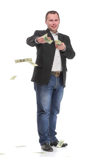 Hezký mladý muž ve formalwear házet peníze a dívat se na kameru — Stock fotografie