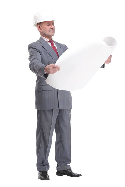 Serious businessman in white hardhat blueprint and looking at camera