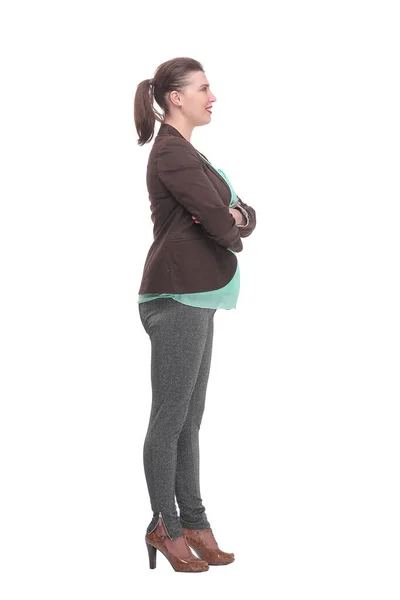 Comprimento total, vista lateral de uma jovem mulher de negócios confiante de pé com as mãos dobradas — Fotografia de Stock