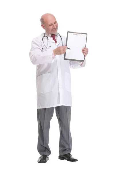Older medical doctor pointing at blank clipboard ad space Stock Picture