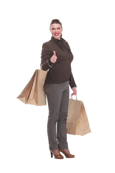 Mujer joven con paquetes de compras aislados en blanco — Foto de Stock