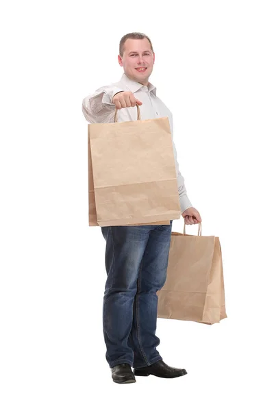 Imagem de belo homem sorridente de terno com sacos de compras — Fotografia de Stock