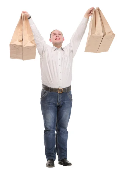 Full isolated studio picture from a young man with shopping bags — Stock Photo, Image