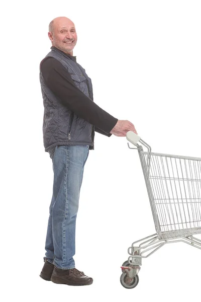 Usmívající se dospělý muž držící nákupní tašky kráčející vpřed — Stock fotografie
