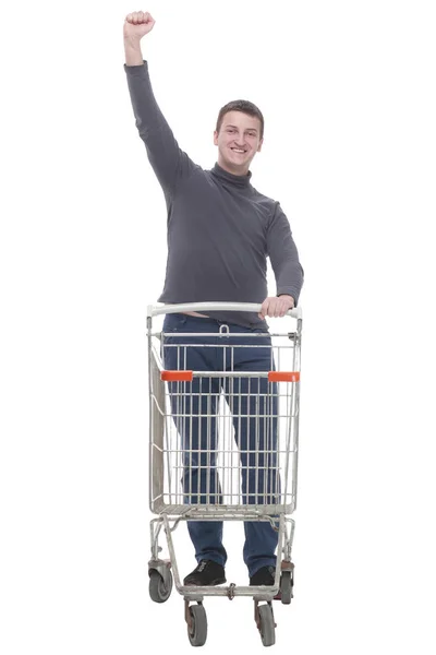 In full growth. casual young man with shopping cart. — Foto Stock