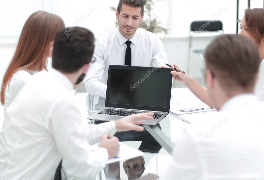 business team holds a meeting in a bright office.the concept of teamwork