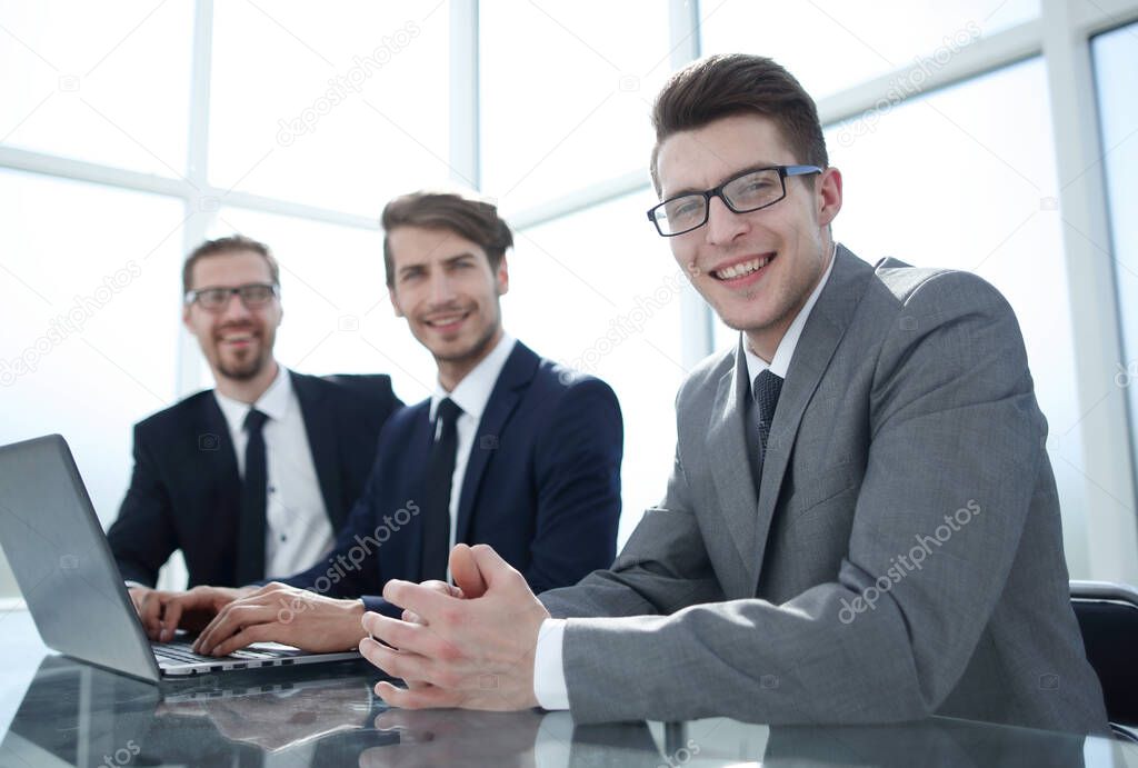 group of successful businessmen sitting at the Desk.photo with copy space