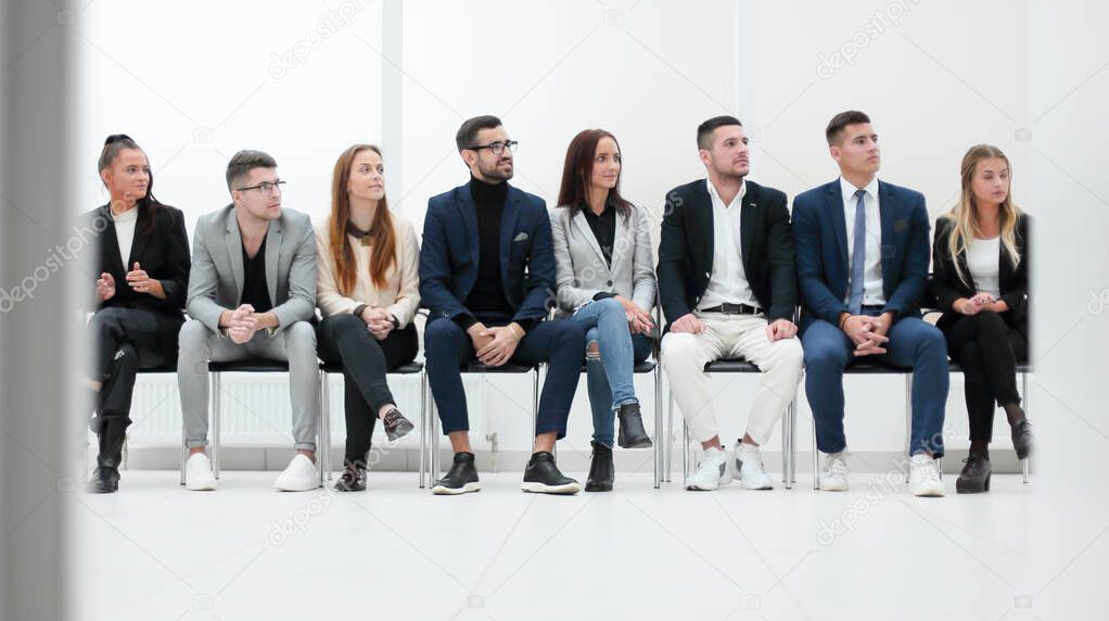 group of diverse business people applauding sitting in a row. photo with copy space