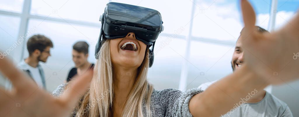 Young girl in virtual augmented reality helmet