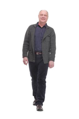 in full growth. Mature man in casual clothes striding forward.isolated on a white background.