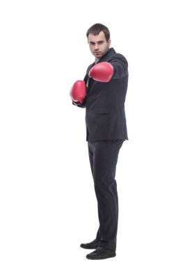 Business man ready to fight with boxing gloves looking at camera isolated over white background clipart