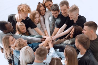 close up. a group of diverse people joining their hands in a circle. clipart