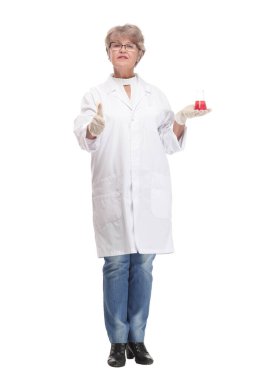 Mature woman doctor in medical suit holding beaker with red liquid clipart