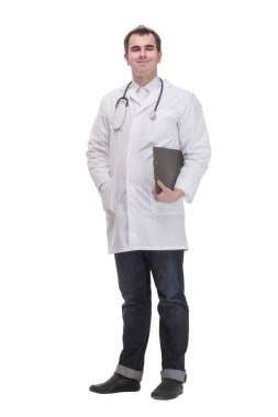 Side view of cheerful mature doctor looking at camera and smiling with clipboard, standing against white background