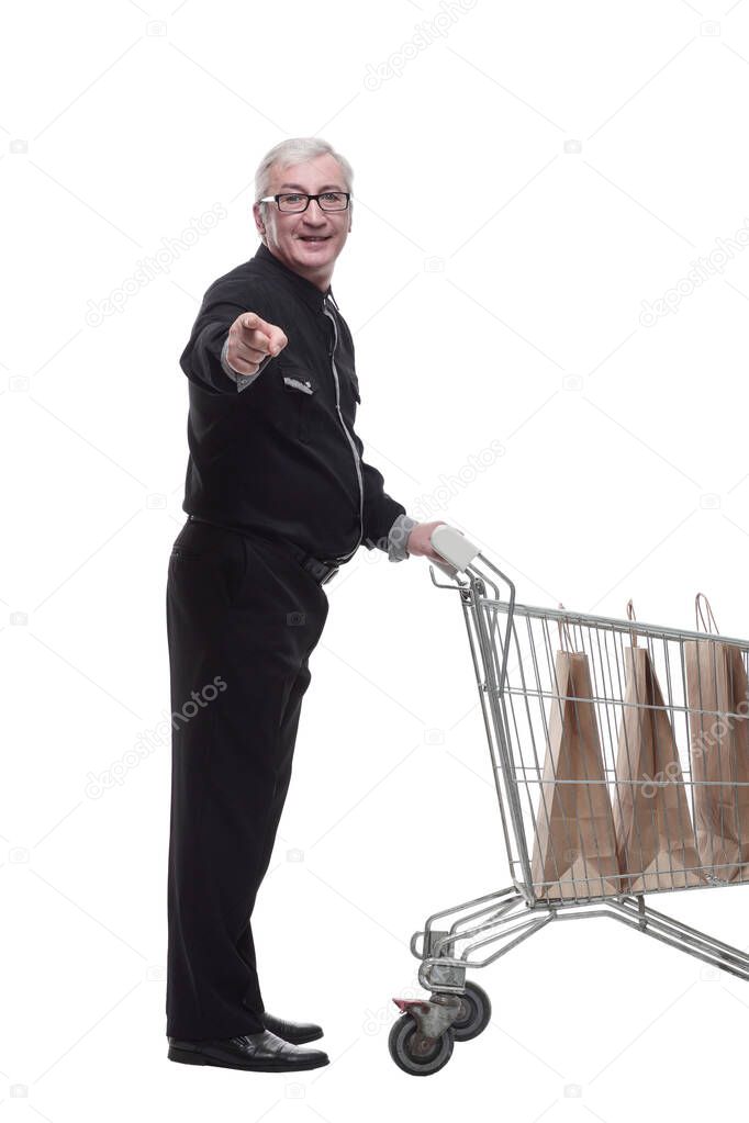 in full growth. happy old man with a shopping cart . isolated on a white background.