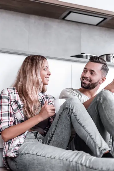 Close Young Couple Drinking Coffee Sitting Kitchen Floor — Stock Photo, Image