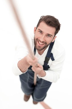 Beyaz ip up.isolated tırmanma inşaat işçisi.