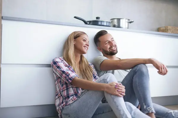 Close Happy Couple Discussing Something Sitting Kitchen Floor — Stock Photo, Image