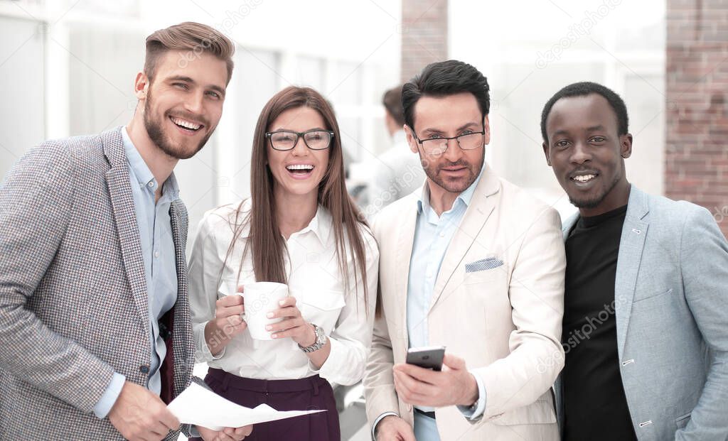 portrait of smiling business team on office background