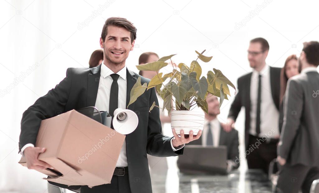 young employee on the background of a new workplace.business concept