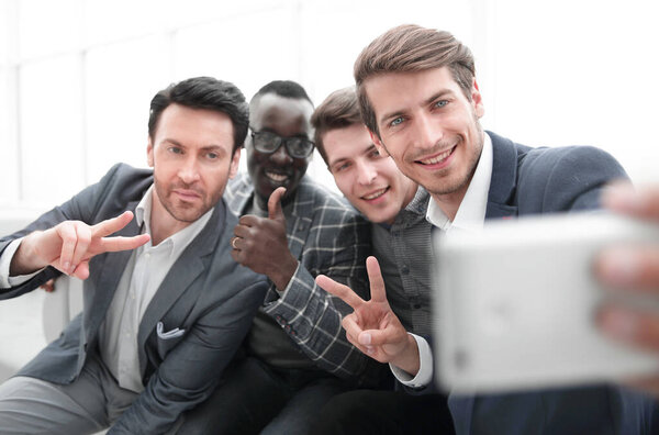 close up.a group of young employees takes a selfie.photo with copy space